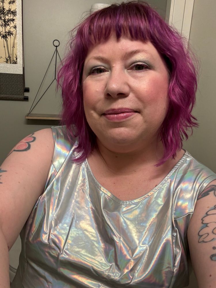 Me! With pink/purple hair and a holographic silver dress. And I’m wearing makeup! Headed to the Sessanta concert in WA