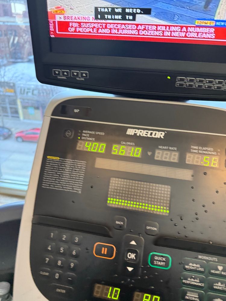 Treadmill showing 4 miles, 561 calories