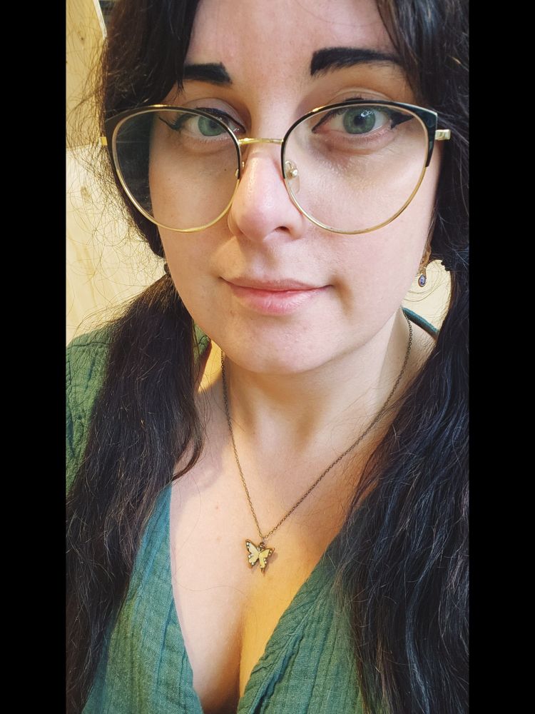 A girl with black hair and glasses 