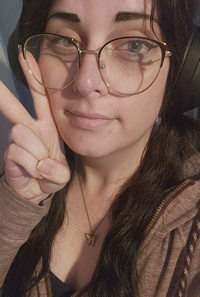 A girl with black hair and glasses 