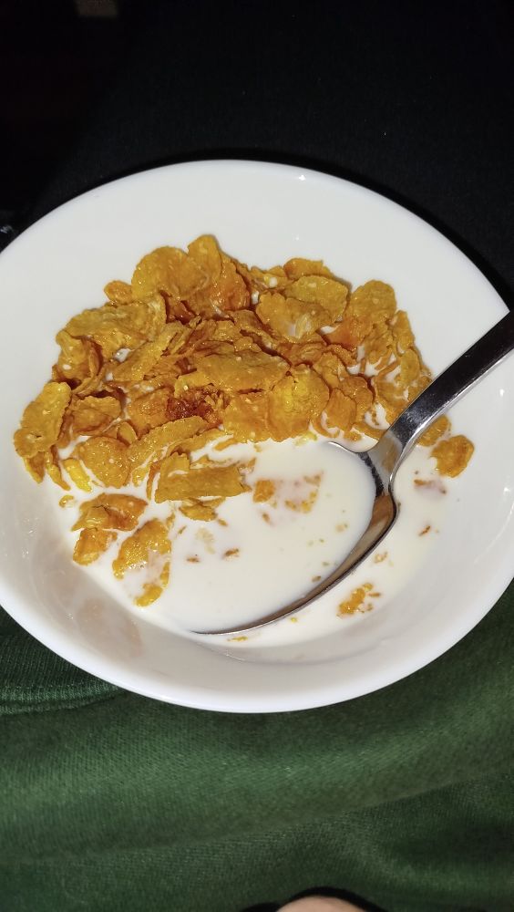 a bowl of crunchy nut cereal with milk
