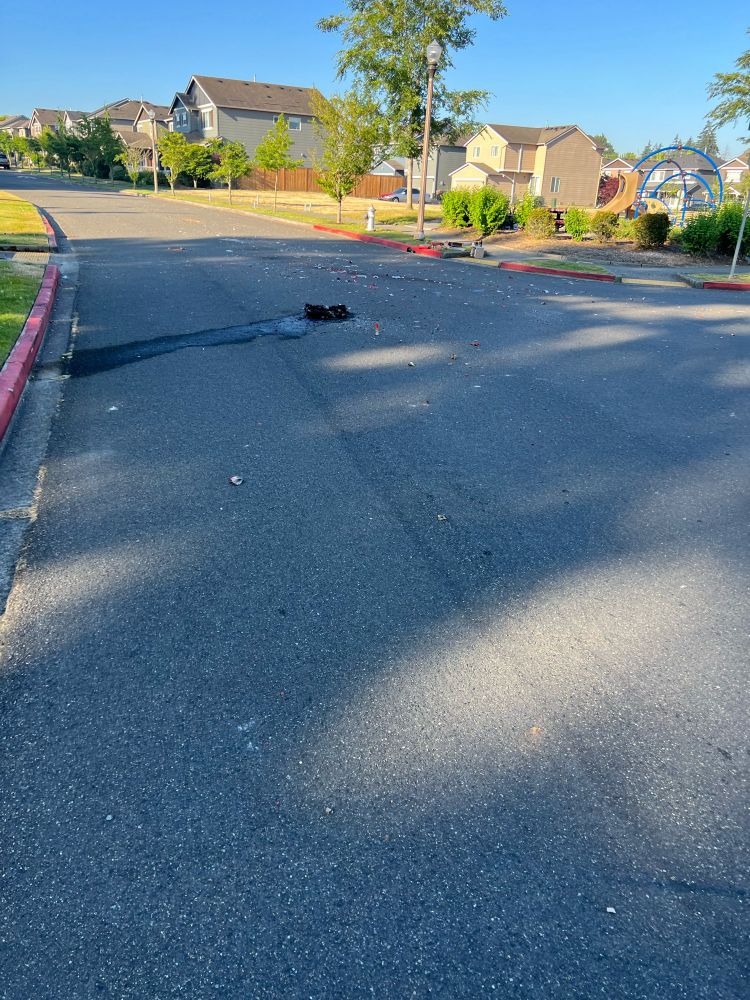Spent fireworks in the middle of the street.
