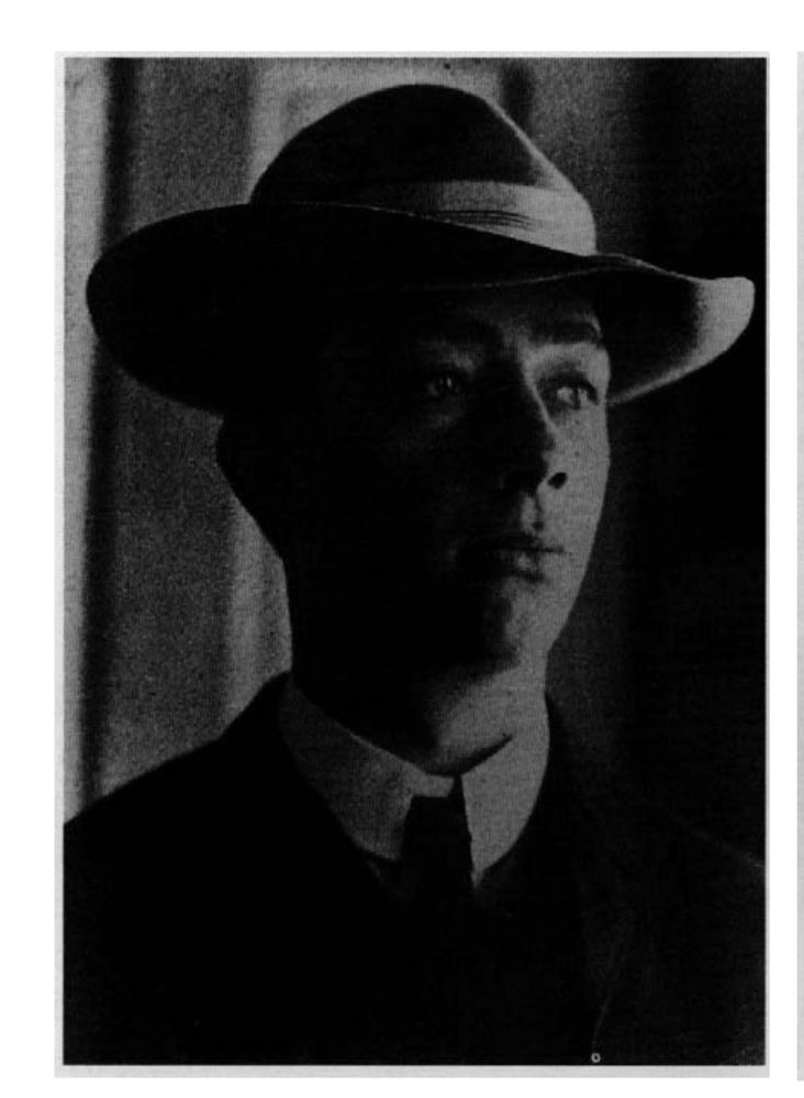 a black and white photo of ecologist Henry Gleason as a grad student in 1905. He's a handsome young white dude looking off in the distance while wearing a sweater over a collared shirt and tie, with a jaunty formal wool hat that's half park-ranger half-godfather style.