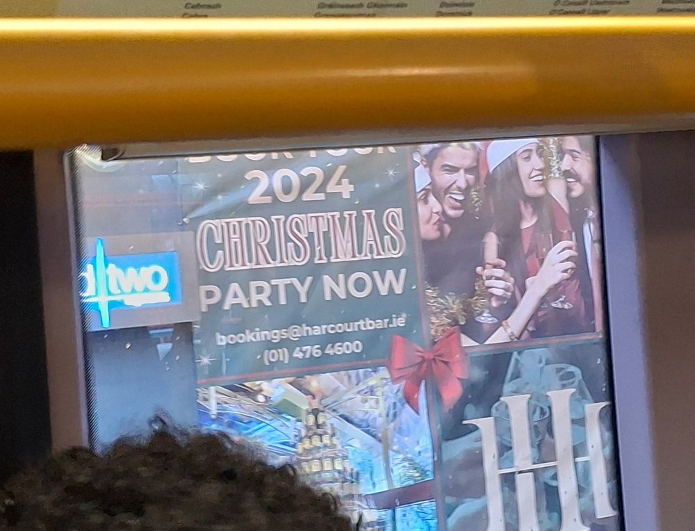 Banner outside The Harcourt Hotel "Book your 2024 Christmas party now" 
