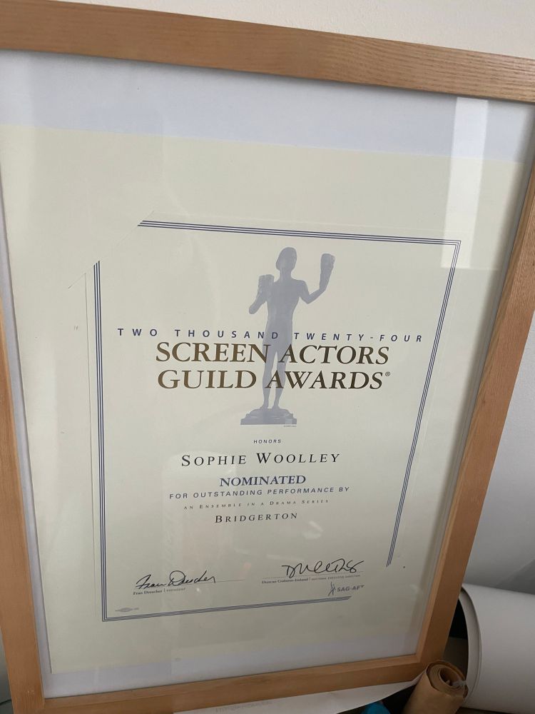 Screen actors guild award certificate for sophie woolley nominated for best ensemble cast in a tv drama, Bridgerton, in a frame
