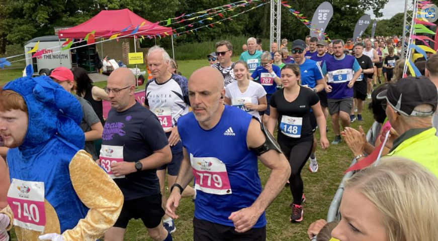 Runners crossing the start line at the Wythall Fun Run 2024