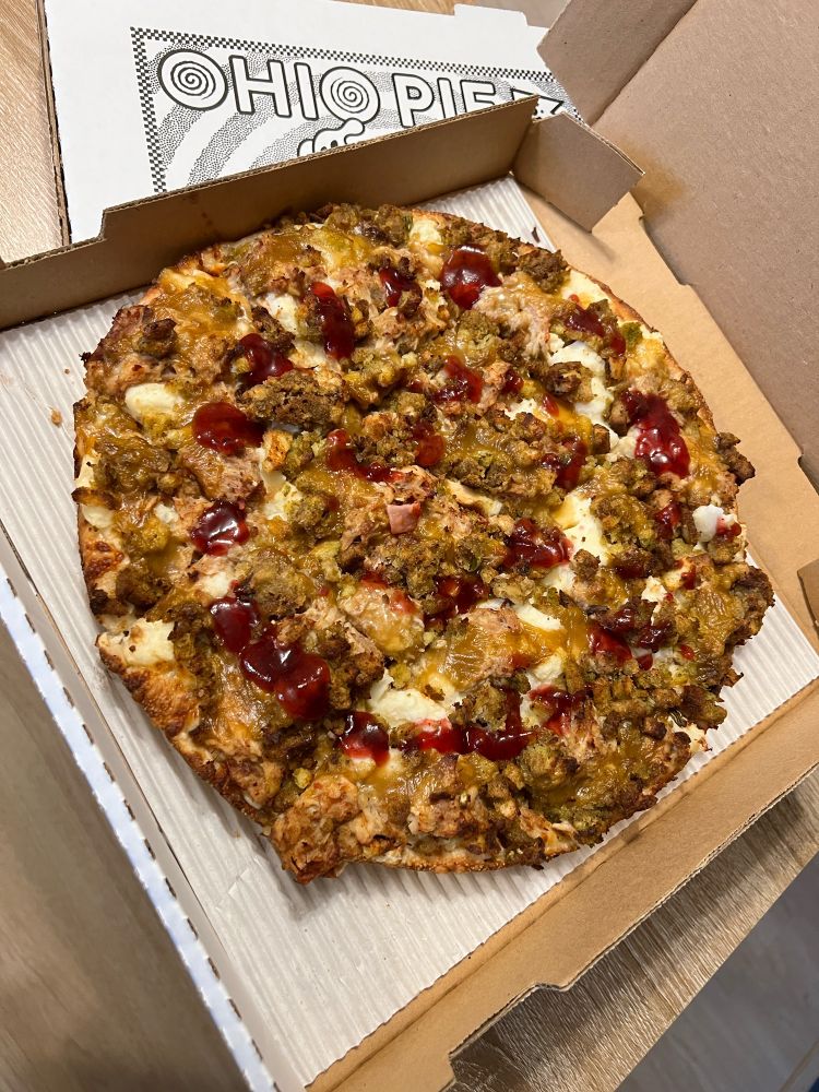 A pizza with thanksgiving style toppings