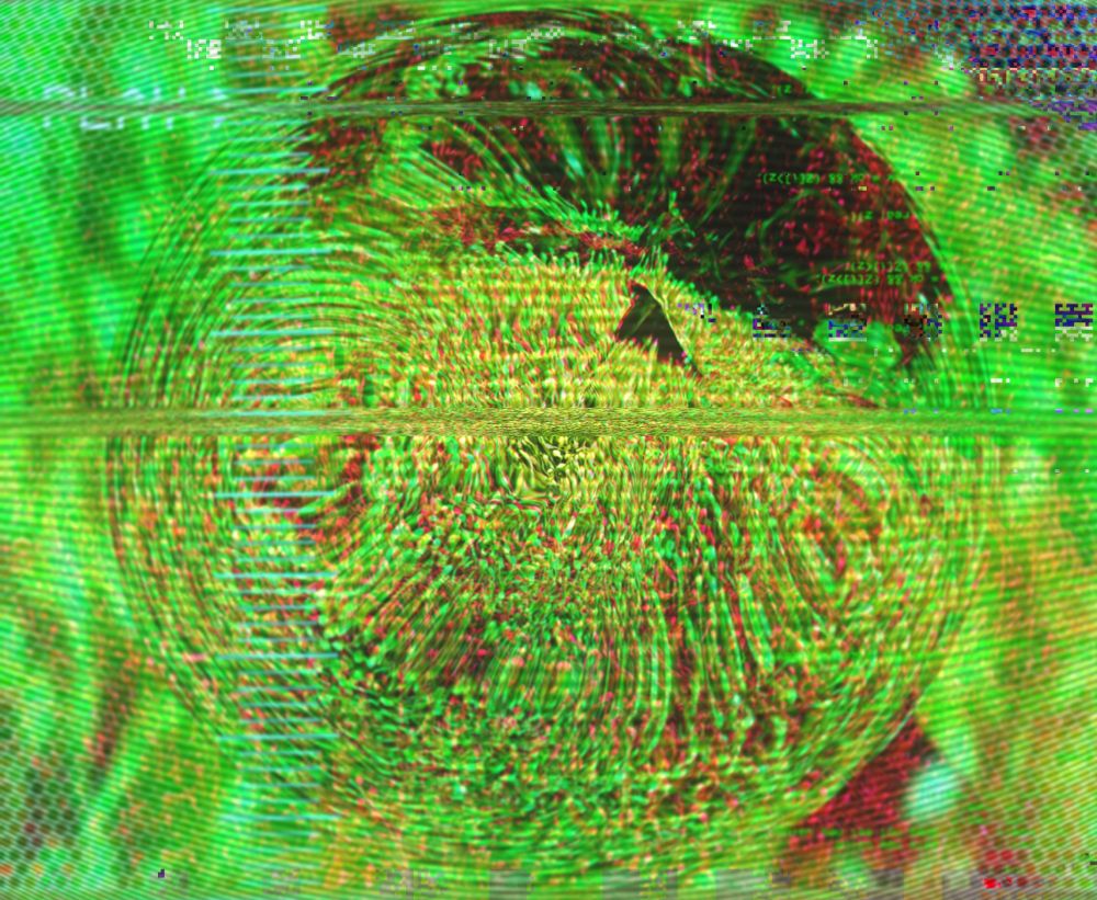 Distorted photo. Scotch moss encased in what looks like a glass sphere, against a blurry green background with a small hexagonal pattern in the corners. Everything is a vivid green. The text "play" is partially visible, obscured by distortion.