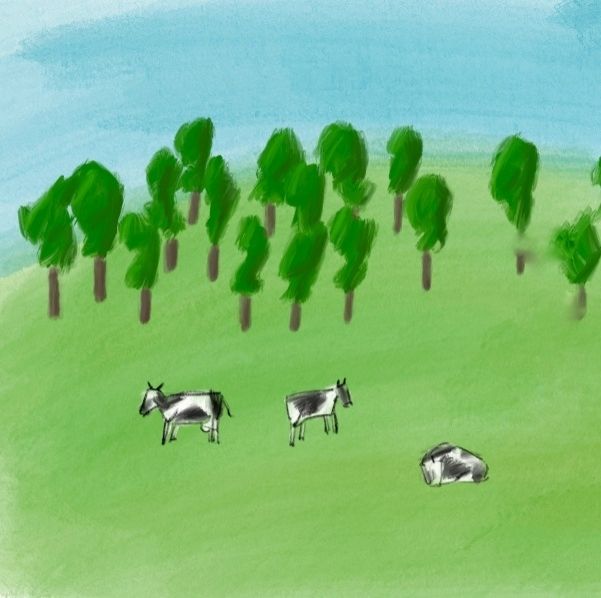 Tres vacas a pacer nun prado.