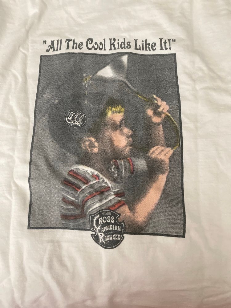 Cross Canadian Ragweed shirt with a child using a funnel with the quote of All the cool kids like it. 