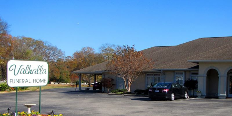 "Valhalla Funeral Home" sign in front of a building.