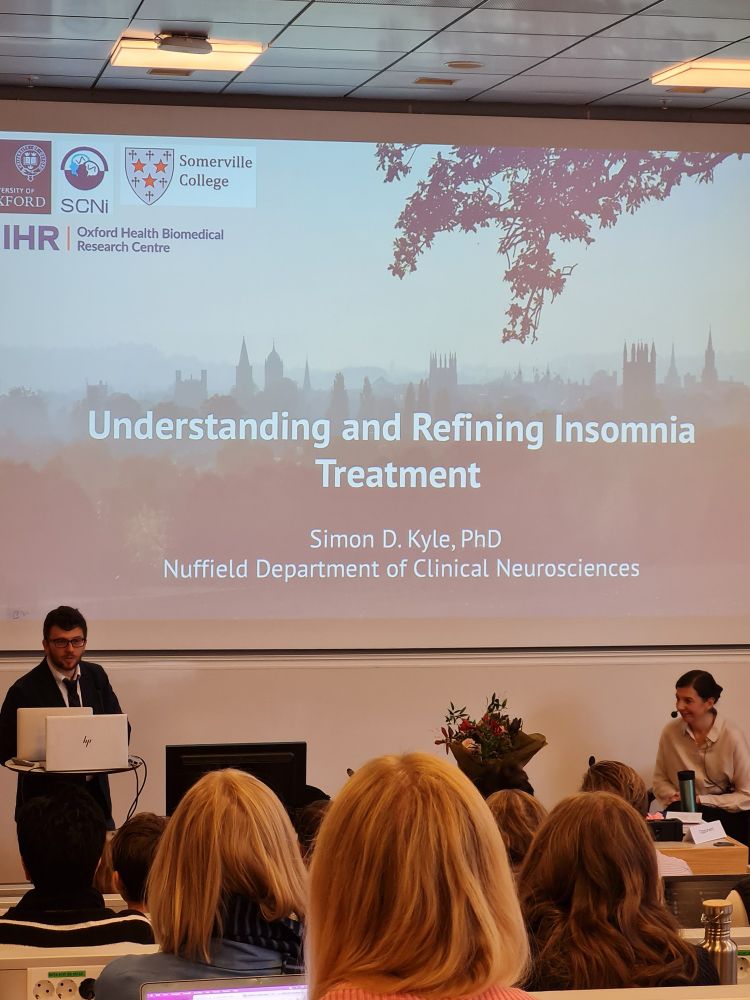 Professor Simon Kyle holds a presentation about insomnia treatment.