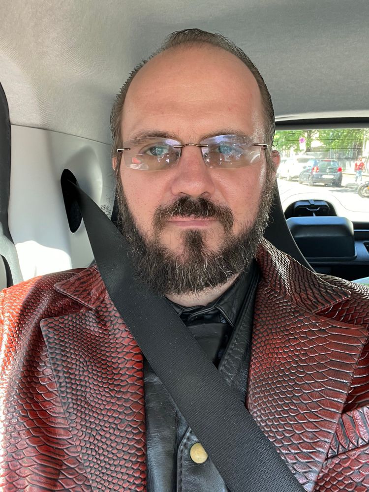 Me in my dragon skin leather suit in the car driving to the opera 