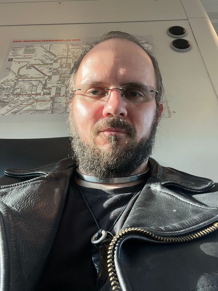 Me in almost full leather in the train, travelling to the SM camp. 
