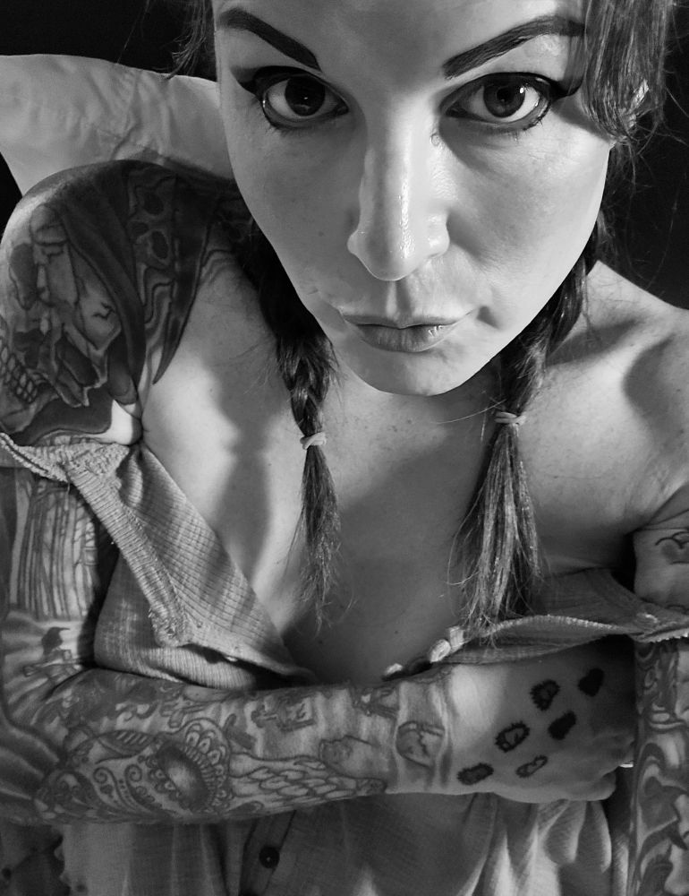 Jade giving you her best "Come fuck me eyes" in a black and white photo 