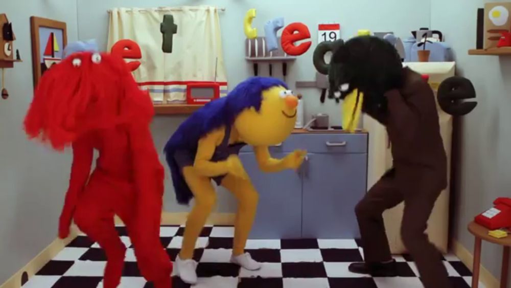 a group of cartoon characters are dancing in a kitchen with a calendar on the wall that says 19