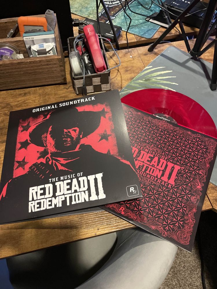 A copy of the Red Dead Redemption 2 vinyl record on a table. 