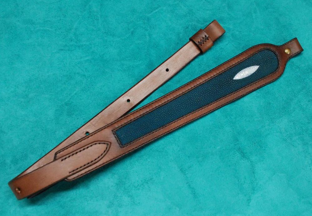 A leather rifle sling with a ~stingray skin~ accent
