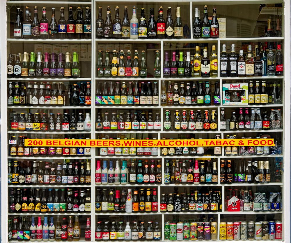 Photo of a shop window containing dozens of Belgian bottles in shelves filling the window. Sign on the window reads " 200 Belgian Beers, Wines, Alcohol, Tabac & Food"
OM Digital Solutions OM-1
OLYMPUS M.12-100mm F4.0
@ƒ/4.0 57.0mm 1/1000s ISO800