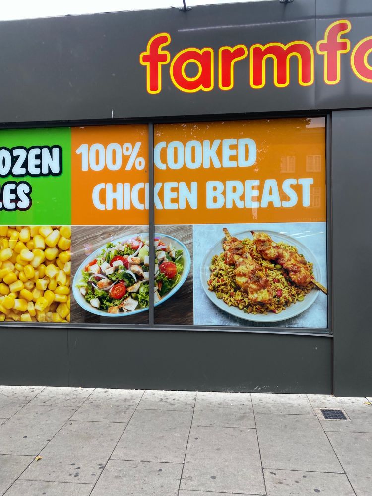A shop that only sells ready meals with a big sign in the window promising “100% COOKED CHICKEN”