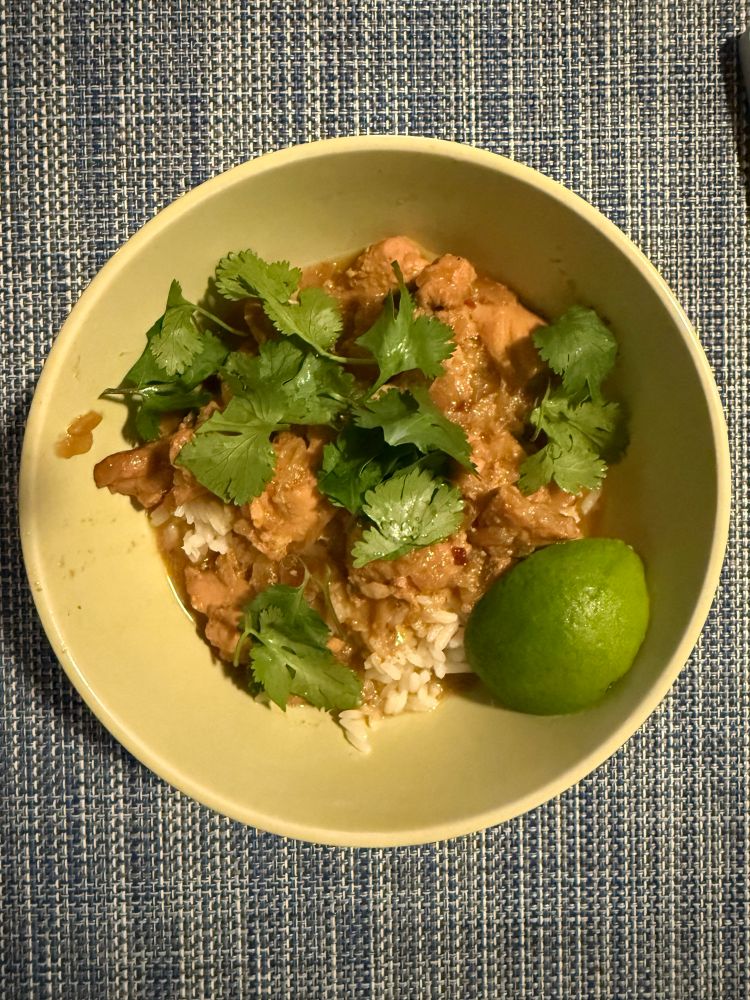 The curry with rice and some cilantro plus a lime 