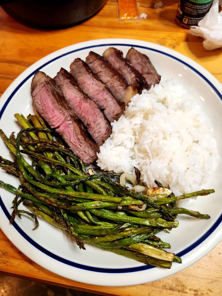Steak, rice, and asparagus. 