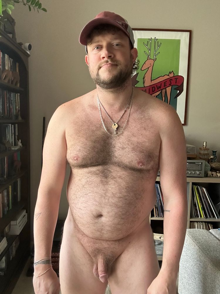 Me naked in a hat in front of the window