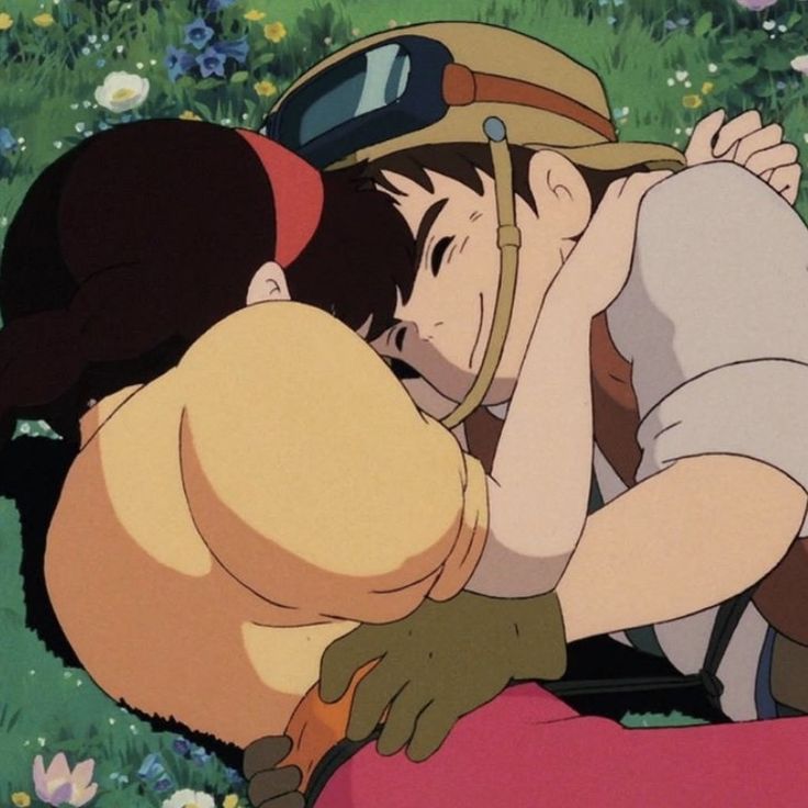 pazu and sheeta from castle in the sky (studio ghibli movie) laying on the grass hugging each other and smiling 