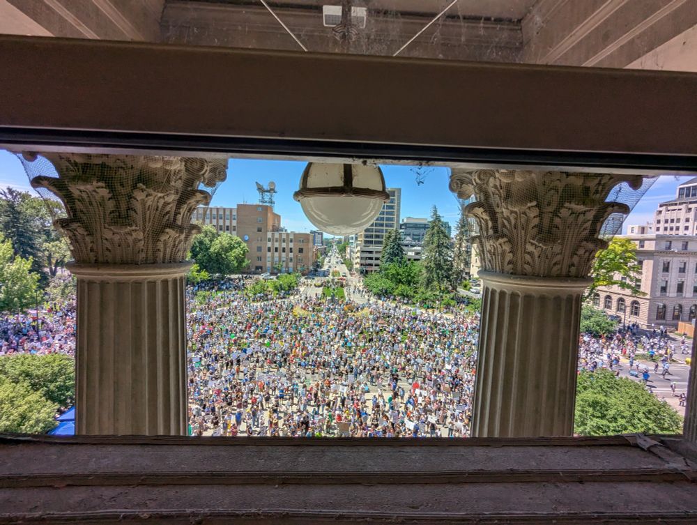 View of June 14th No Kings Protest in Boise, Idaho. People kept coming into the park after I took this picture. Looking south from the 4th floor of the Statehouse.