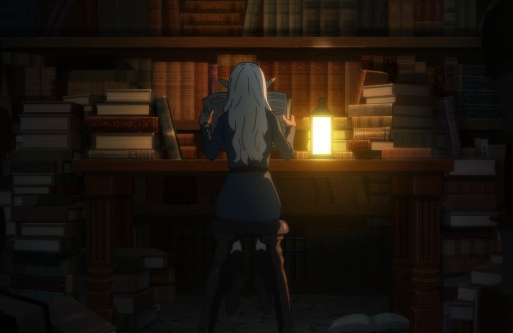 Screenshot from the Dungeon Meshi anime. Thistle is sitting with their back towards the viewer, their hair is down and they’re reading a book. The room is dark, the only lightsource being a tiny lamp that’s on the table in front of Thistle. The room is full of books.