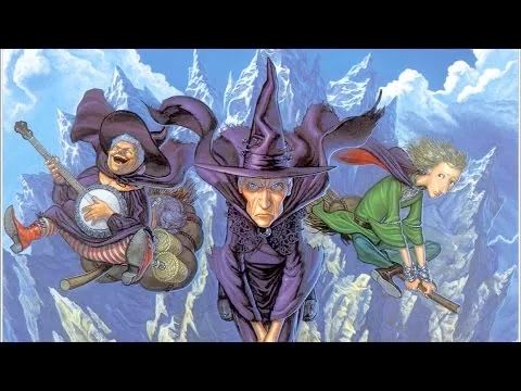 Three witches of Terry Pratchett's Discworld fly on brooms toward the viewer: Nanny Ogg, Granny Weatherwax, and Magrat Garlick.