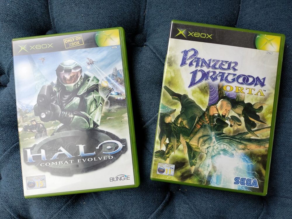 Game boxes for Halo Combat Evolved and Panzer Dragoon Orta on the Xbox. 