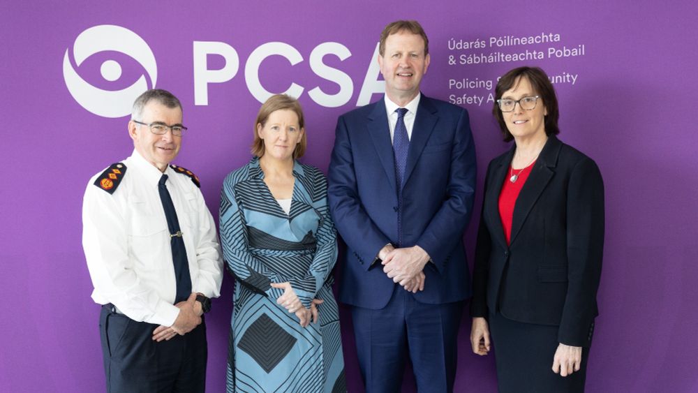 Commissioner Drew Harris, Chairperson Elaine Byrne, Minister Jim O’Callaghan, and CEO Helen Hall stand smiling in front of PCSA banner.