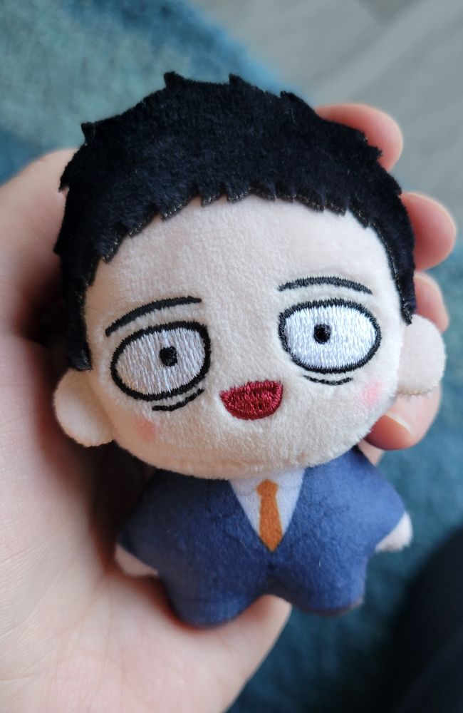 A tiny, plushie Serizawa sitting in the palm of my hand.