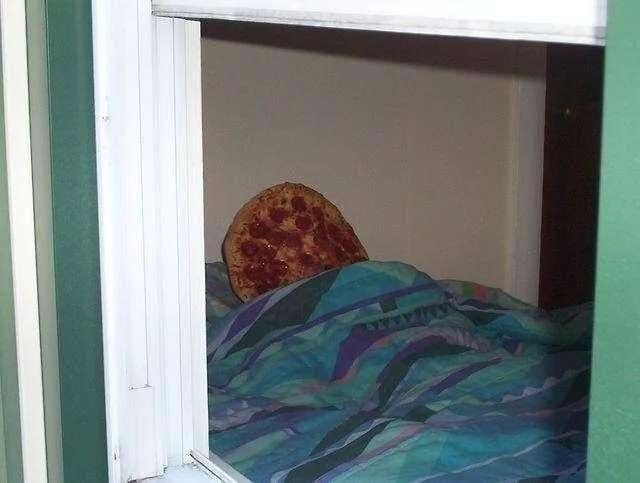 pepperoni pizza tucked in bed 