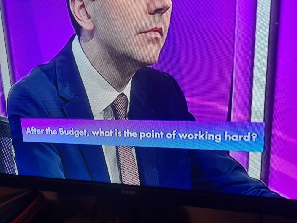 Chyron reading: "After the Budget, what is the point of working hard?"