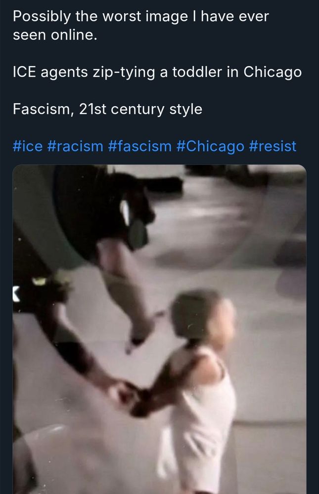 A blurry still of a toddler being handcuffed. Turns out to be his dad chasing him down and the toddler happily plays along with the arrest.