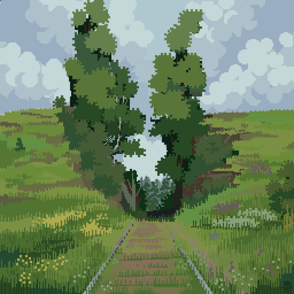 Between 2 trees and 2 hills lie a railway surrounded by grass and flowers