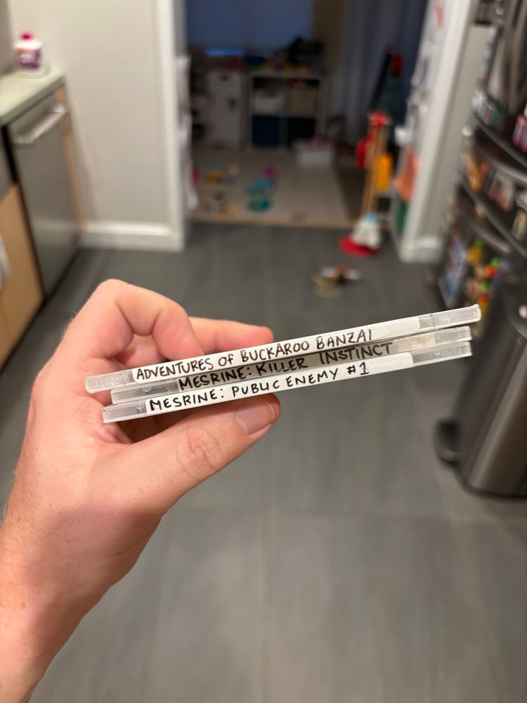 Three DVDs: The Adventures of Buckaroo Banzai, and both Mesrines