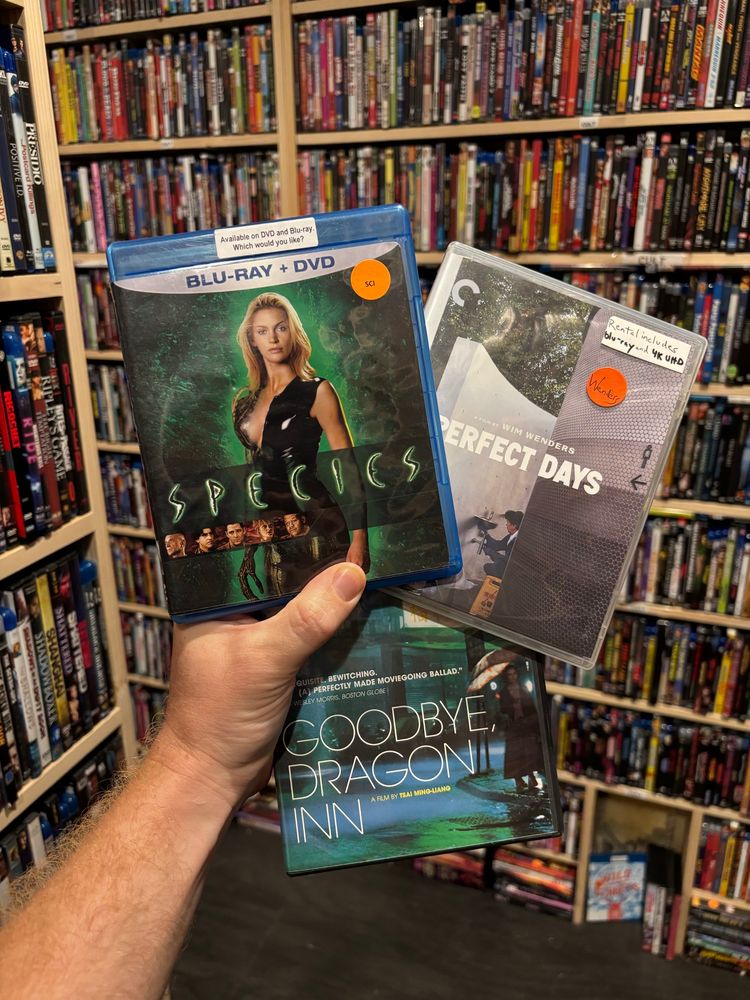 Three DVD cases: Species, Perfect Days, and Goodbye Dragon Inn