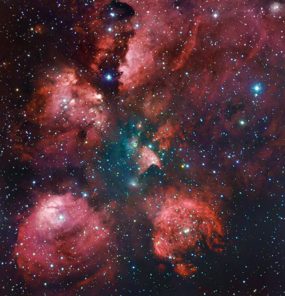 The Cat's Paw Nebula with reddish puffy clouds of glowing gas against a dark sky dotted with stars. Credit: ESO/R. Gendler & R.M. Hannahoe