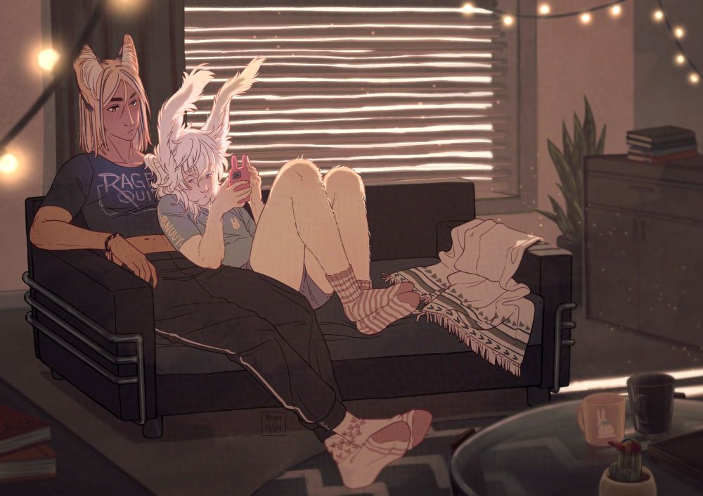 A drawing of a couple sitting on a sofa. Left character is a serval kemonomimi man in a black cropped shirt and sweatpants, and white socks with pink hearts. His hair is straight and blonde with few dark stripes, his face has freckles and kind of a neutral face.
Tight against his side is a pale angora rabbit kemonomimi man, his hair is long and messy and his limbs are fluffy. He has a light blue shirt and tiny lilac pants, and pink striped woolen socks. His expression is very neutral and he's holding a pink phone that has some cartoonish rabbit ears.
The room is dimly lit with some fairy lights and daylight beaming through half-closed blinds. There are various books here and there, and on the foreground there's a coffee table with two mugs, plain black and pink rabbit themed, and a tiny cactus with a colorful cap in a pot.