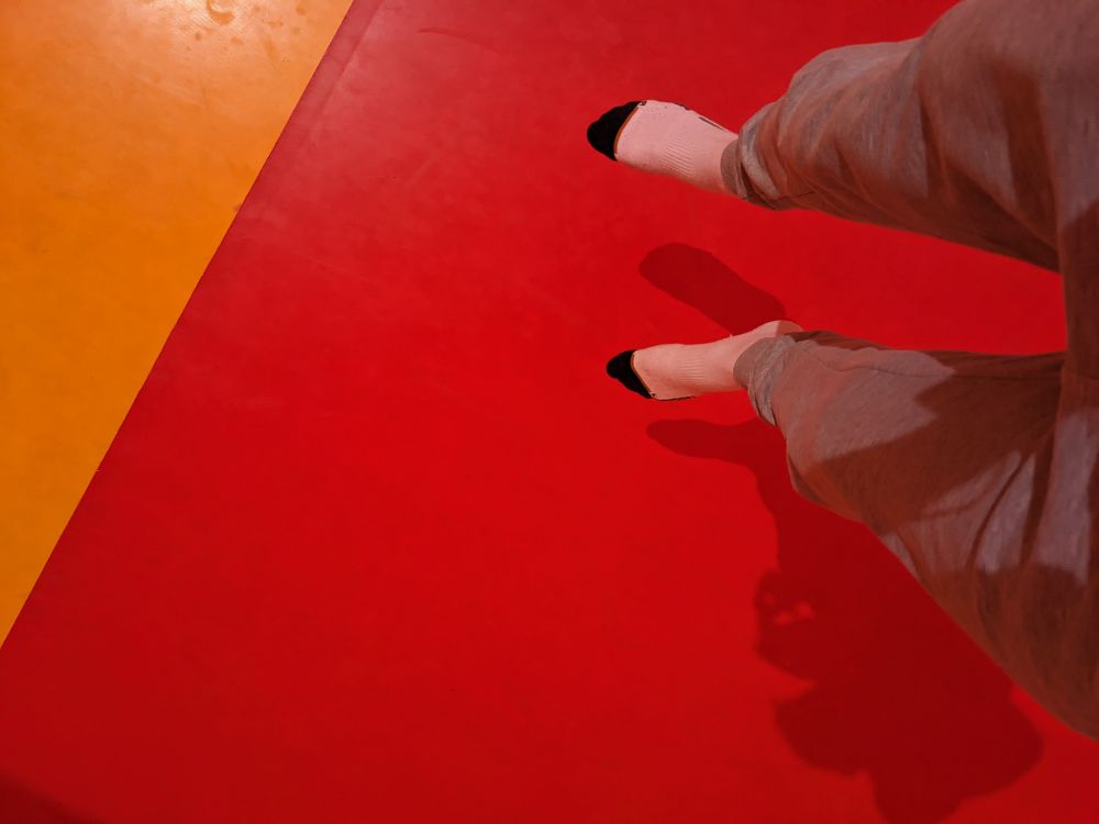 my legs floating above a big jumping pillow thing. i am mid-jump