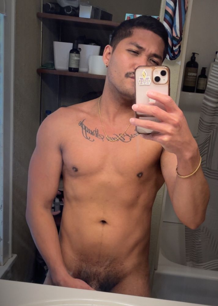 Taking a naked selfie in the bathroom 