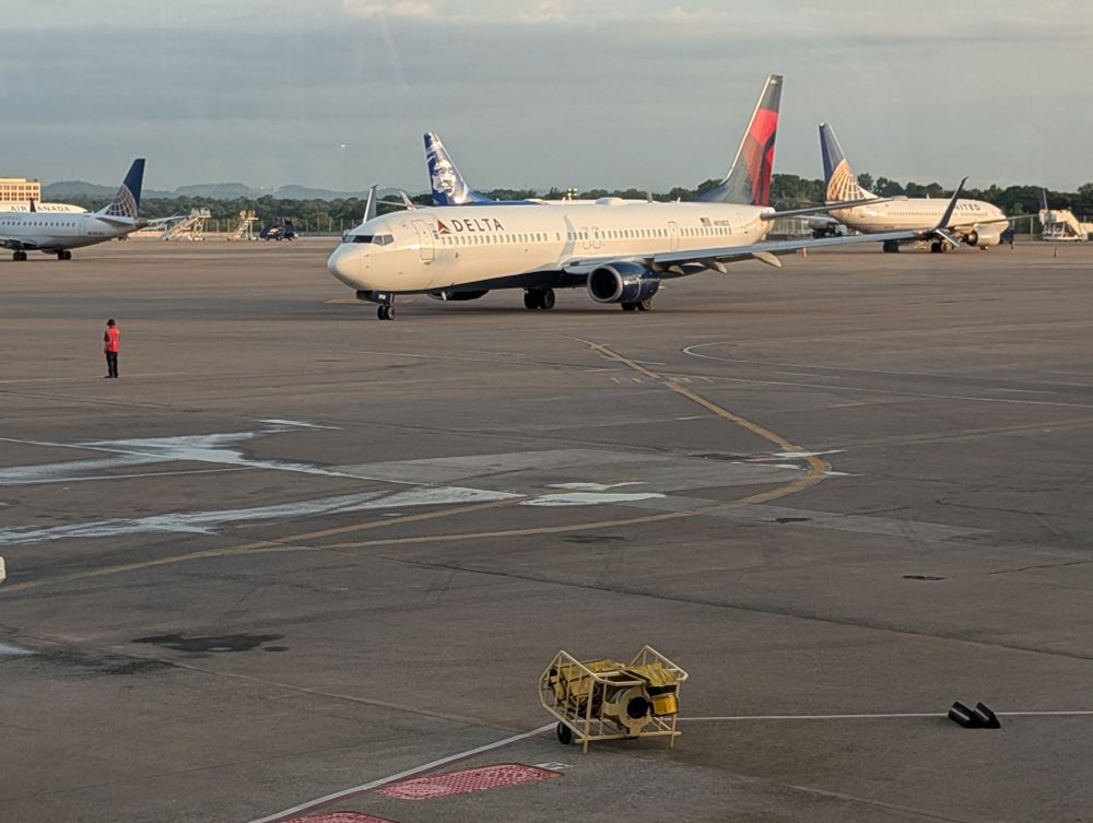 A/B concourse ramps with Delta, United and AIr Canada aircraft.