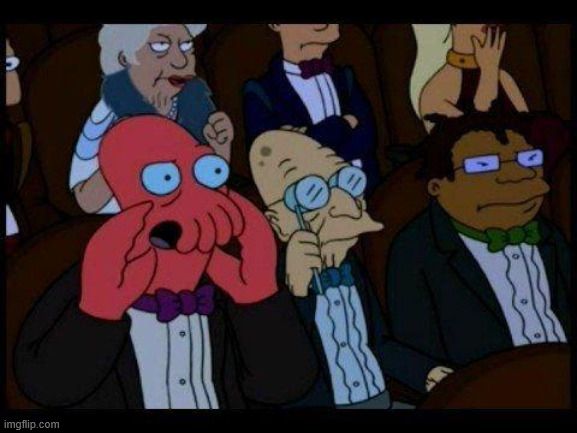 Futurama Meme: Zoidberg (a red humanoid crab monster) in a crowd wearing tuxes, with cupped claws yelling something unspecified at the implied performer on stage.