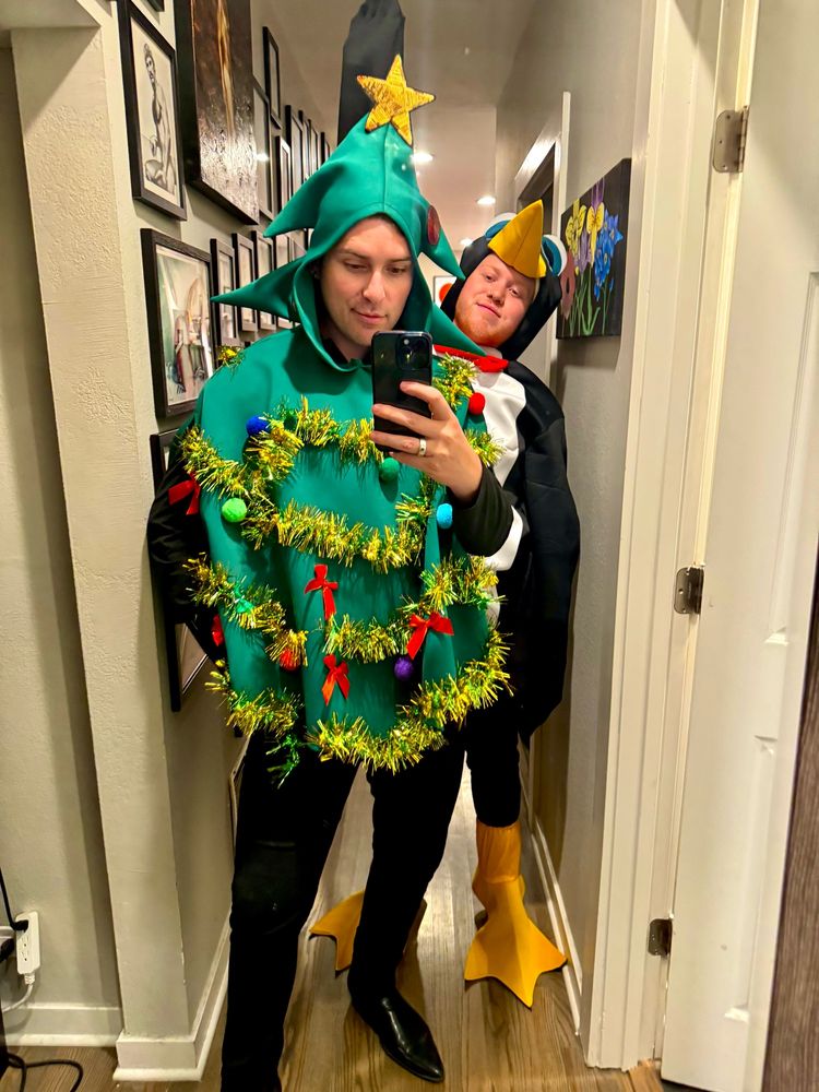 Bryan is a Christmas tree while Caleb is dressed up a penguin for Halloween 2024!