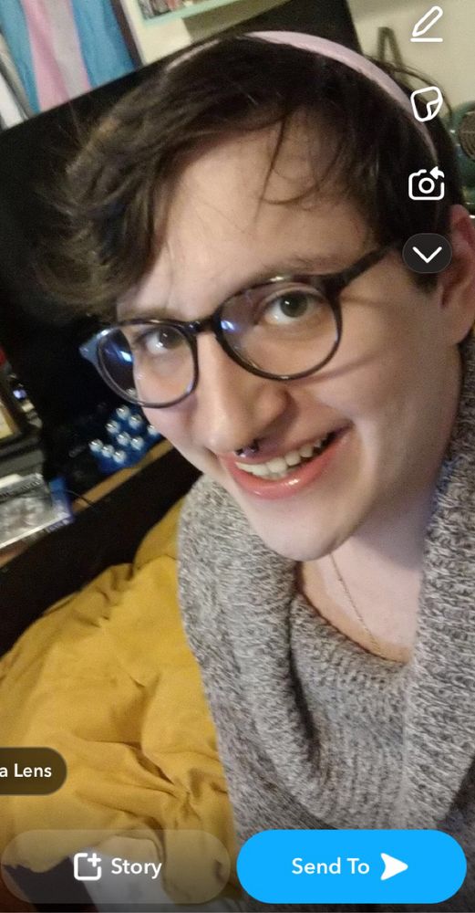 Pre transition selfie, 3/4 face from the chest up. Cute smile!