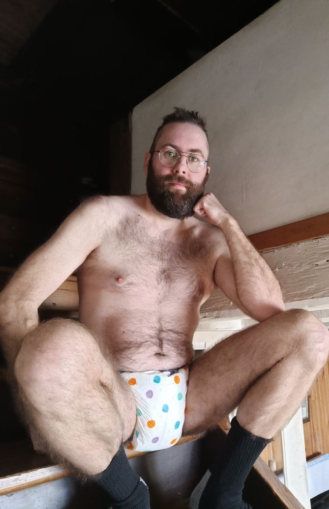 Sitting on the stairs in my Critter caboose diaper. Fresh haircut.
