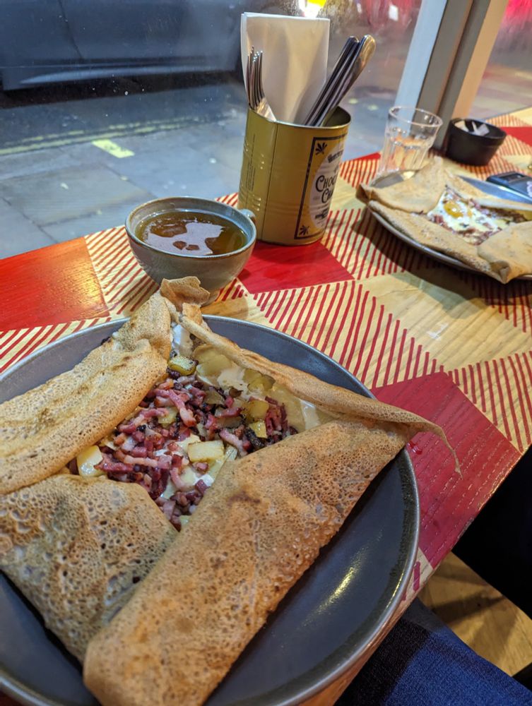 Savoury crepes and cider in a cup